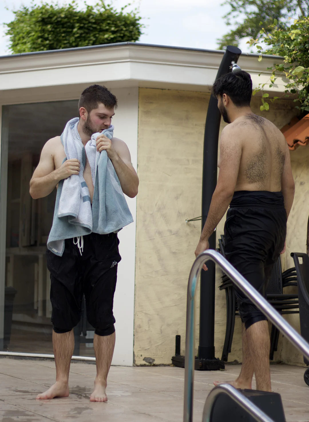 men in an everyday wear half sleeve black tee with a Palestine art on the back