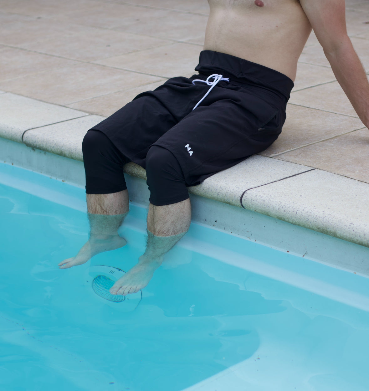 Muslim Man Sitting by the Pool in Modest Islamic Swimwear | Halal Swimwear for Men