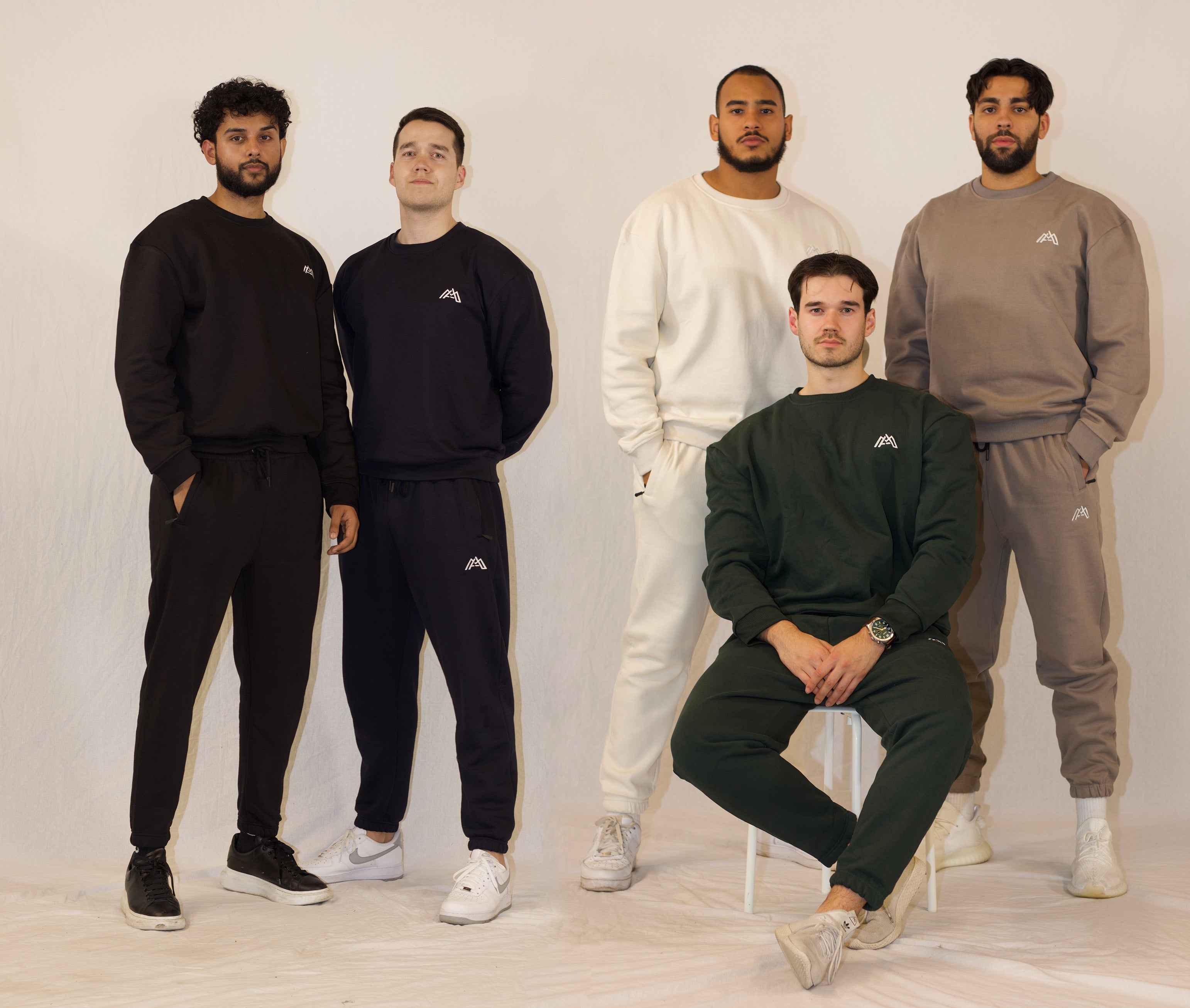 Five muslims in MyAwrah tracksuits showing comfy and stylish modest menswear.